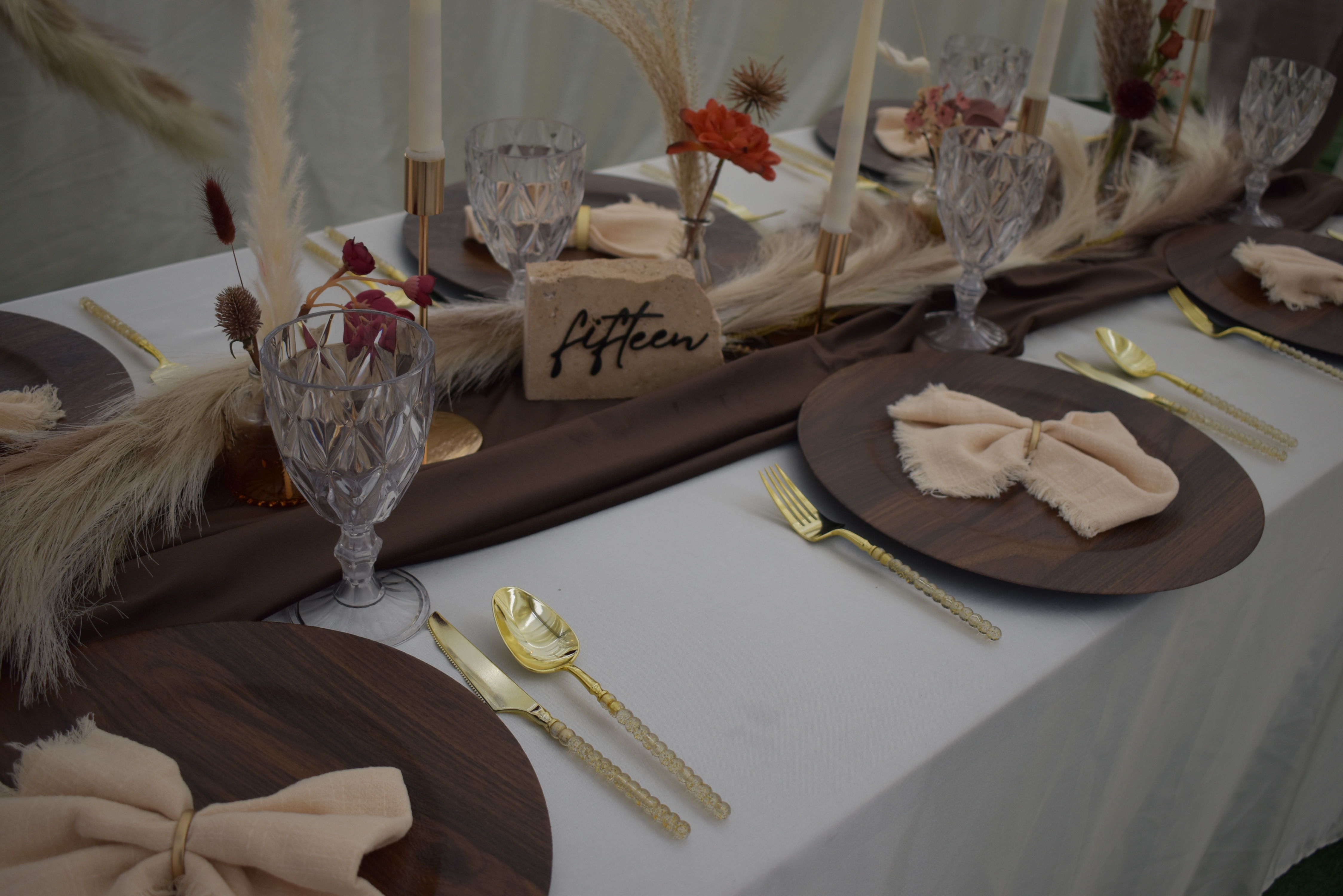 Boho tablescape with pampas grass and gold cutlery