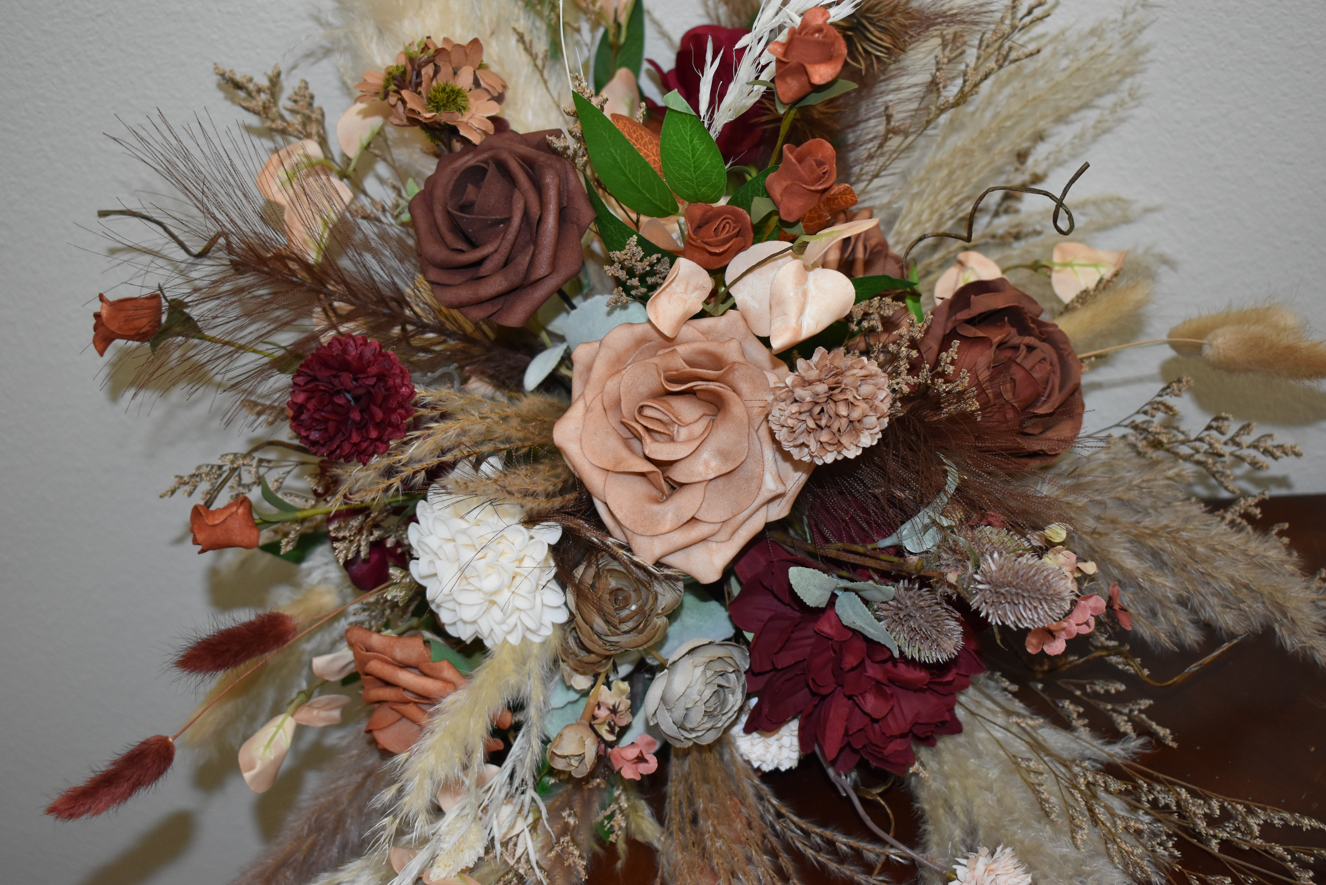 Lush faux floral bouquet in burgundy and mauve